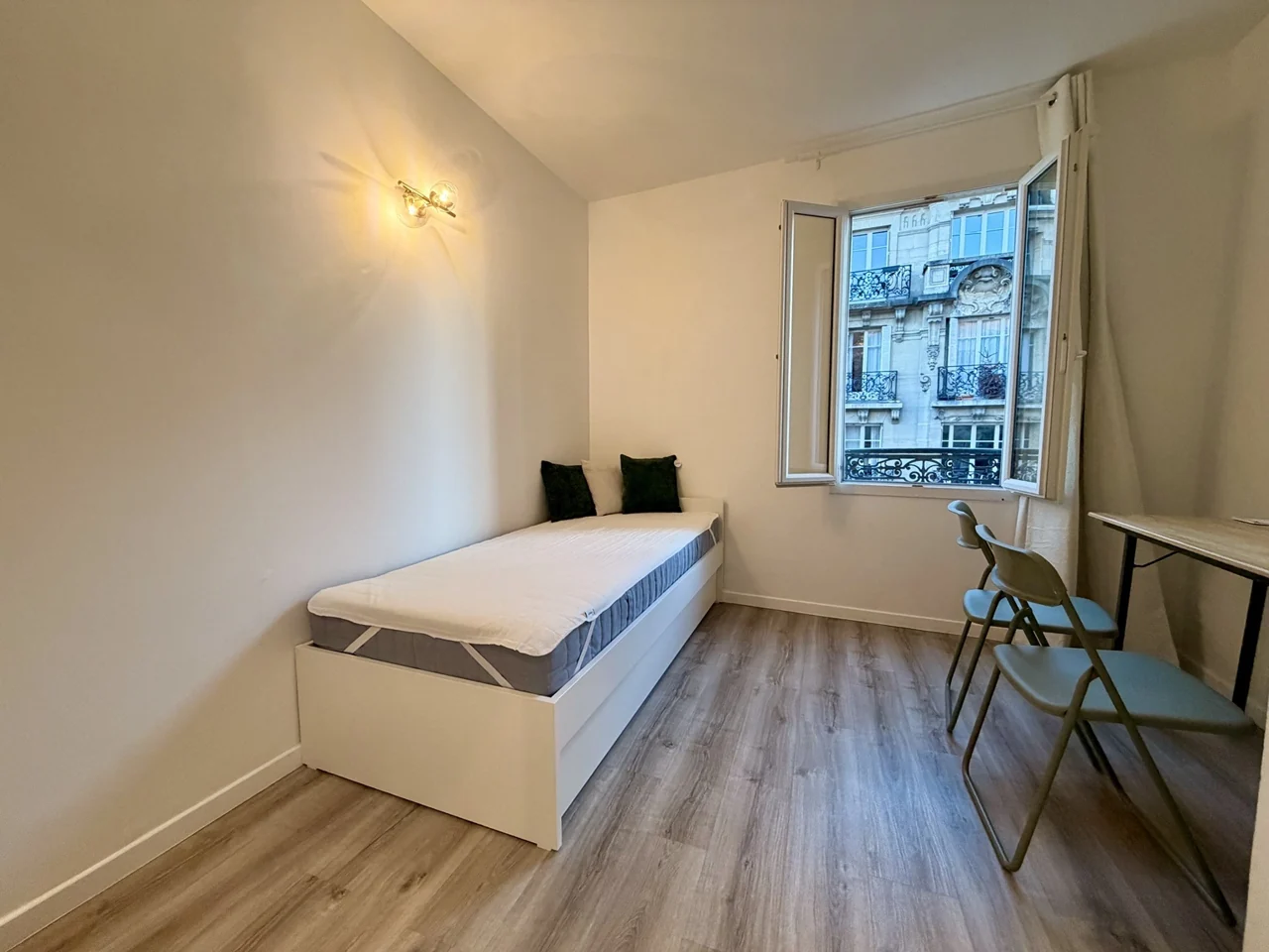 The main room, with trundle bed and window